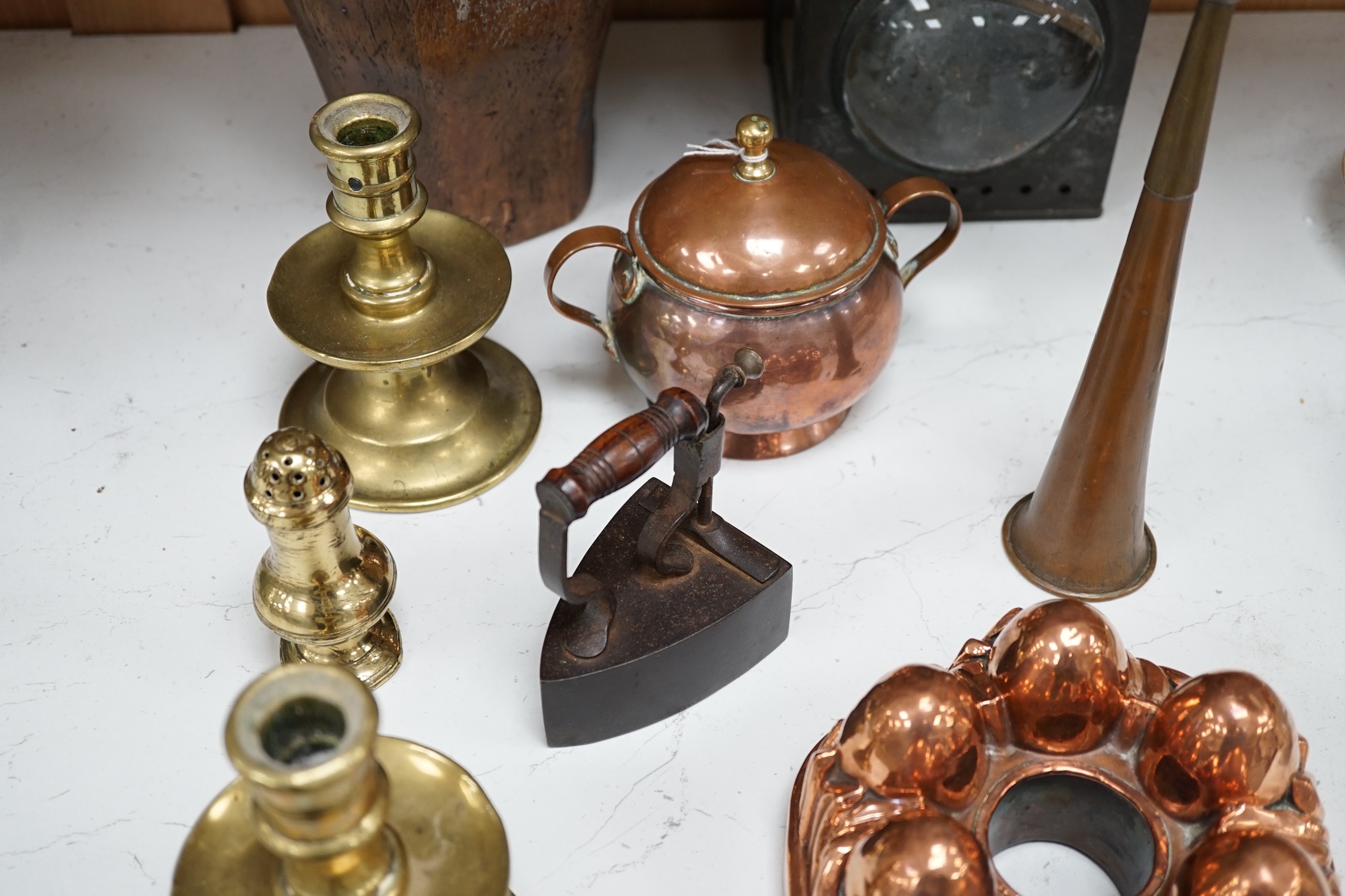 A Toleware lantern, a hatter's block, a copper jelly mould, a slug iron and three other items, tallest 34cm (7). Condition - fair to good